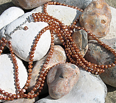 Three 50cm strands necklace of light copper freshwater pearls